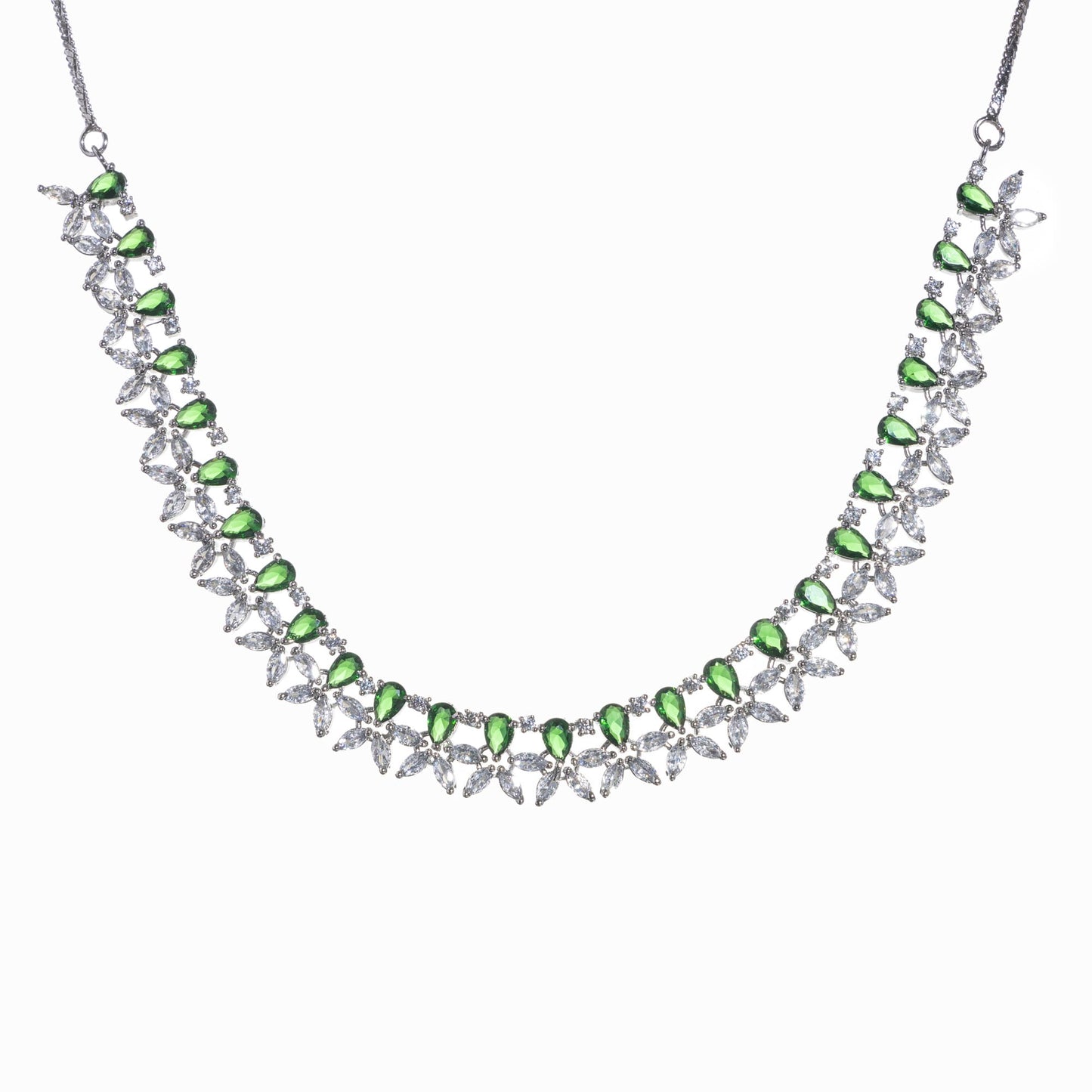 GREEN AND WHITE ZIRCONS IN A FLOWER DESIGN CREATE A VIBRANT, FLORAL ELEGANCE.