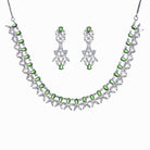 "Green and white zircon necklace in floral design adds vibrant, floral elegance."
