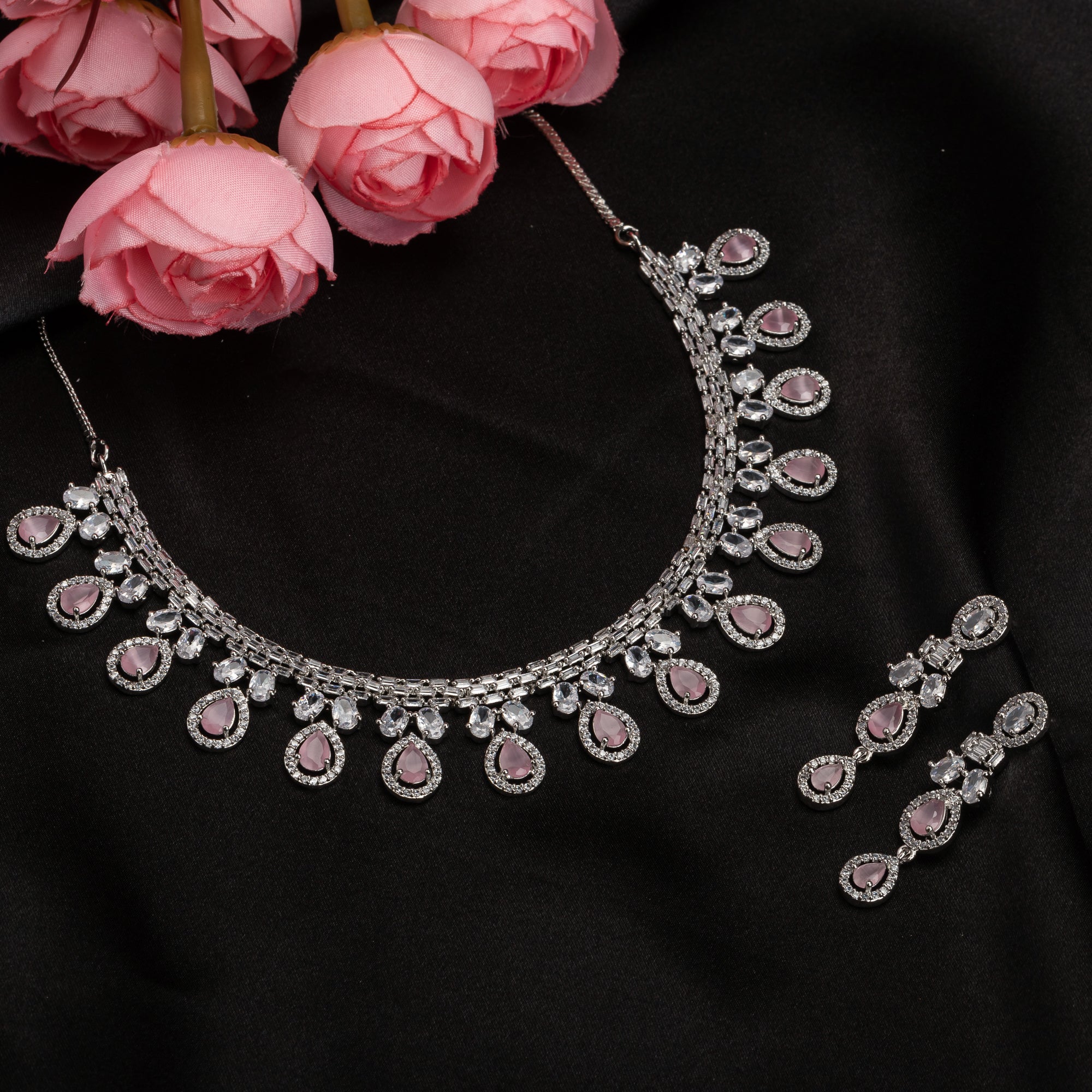 "Pink and white zircon necklace with silver polish creates a stunning, radiant look."
