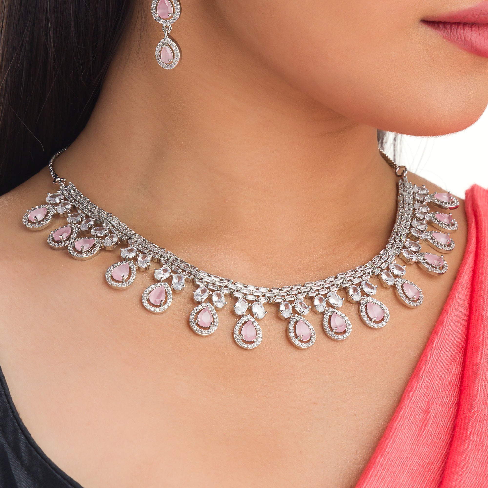 "Pink and white zircon necklace with silver polish creates a stunning, radiant look."
