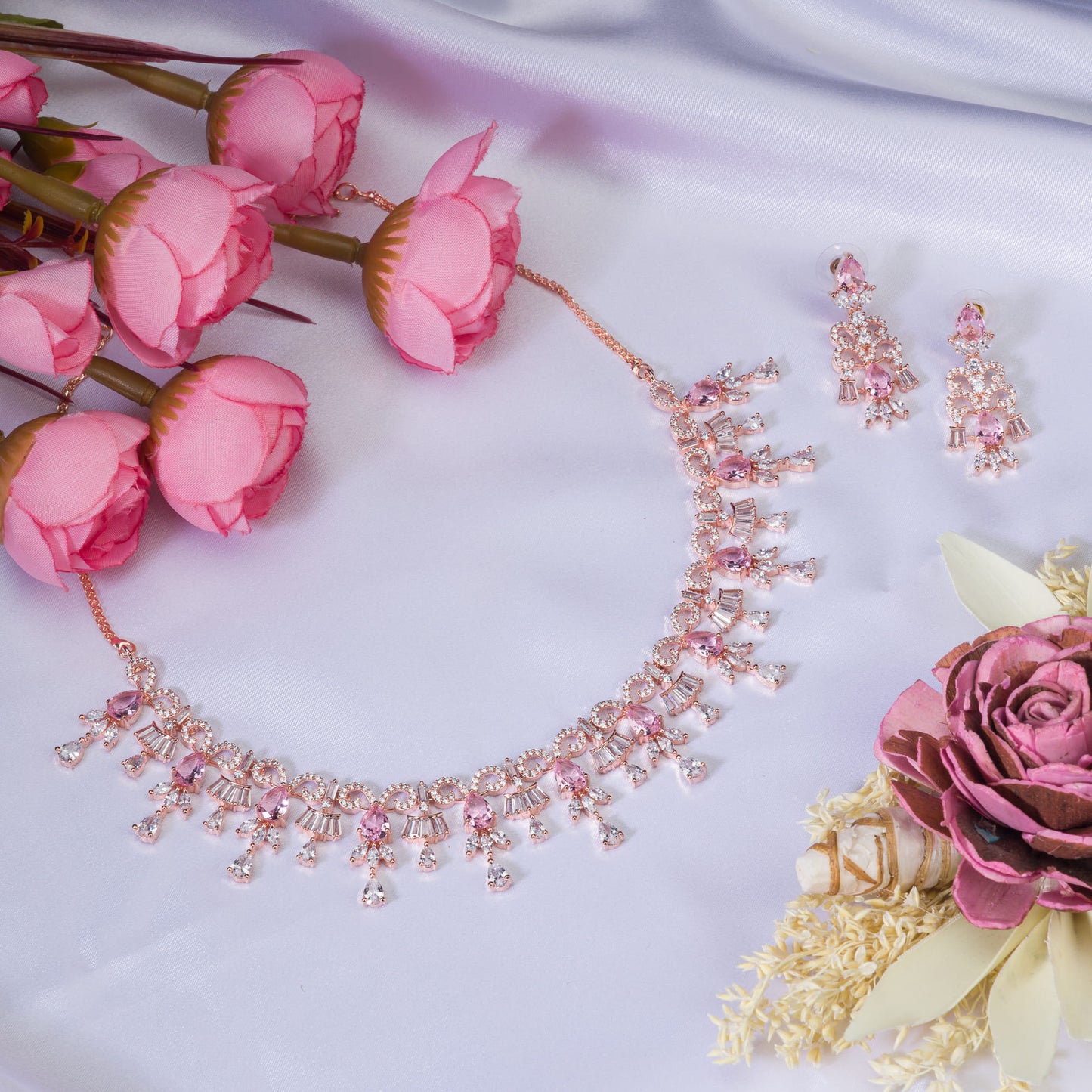 PINK AND WHITE ZIRCONS WITH ROSE GOLD POLISH OFFER A STUNNING, RADIANT LOOK.