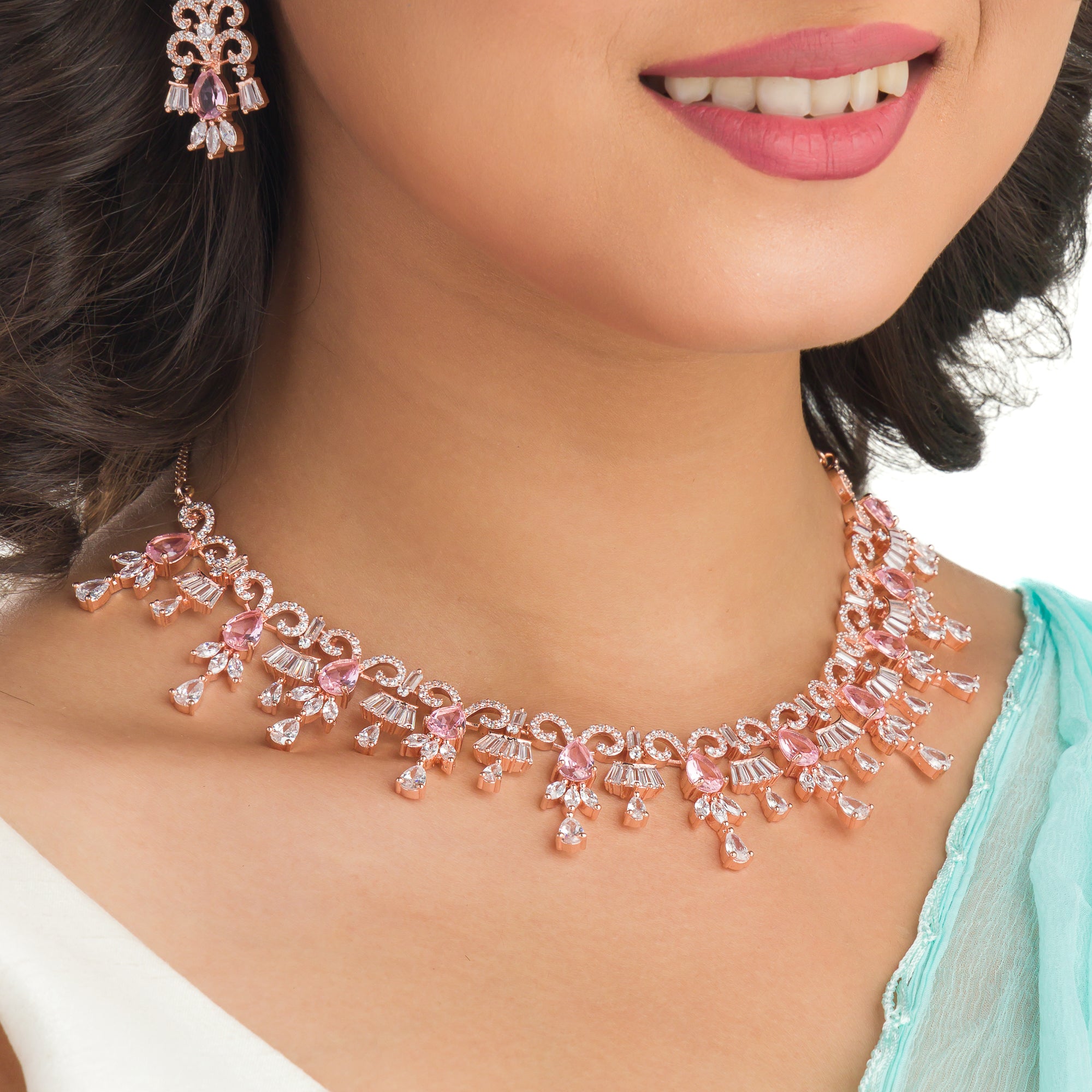 "Pink and white zircon necklace with rose gold polish offers a stunning, radiant look."
