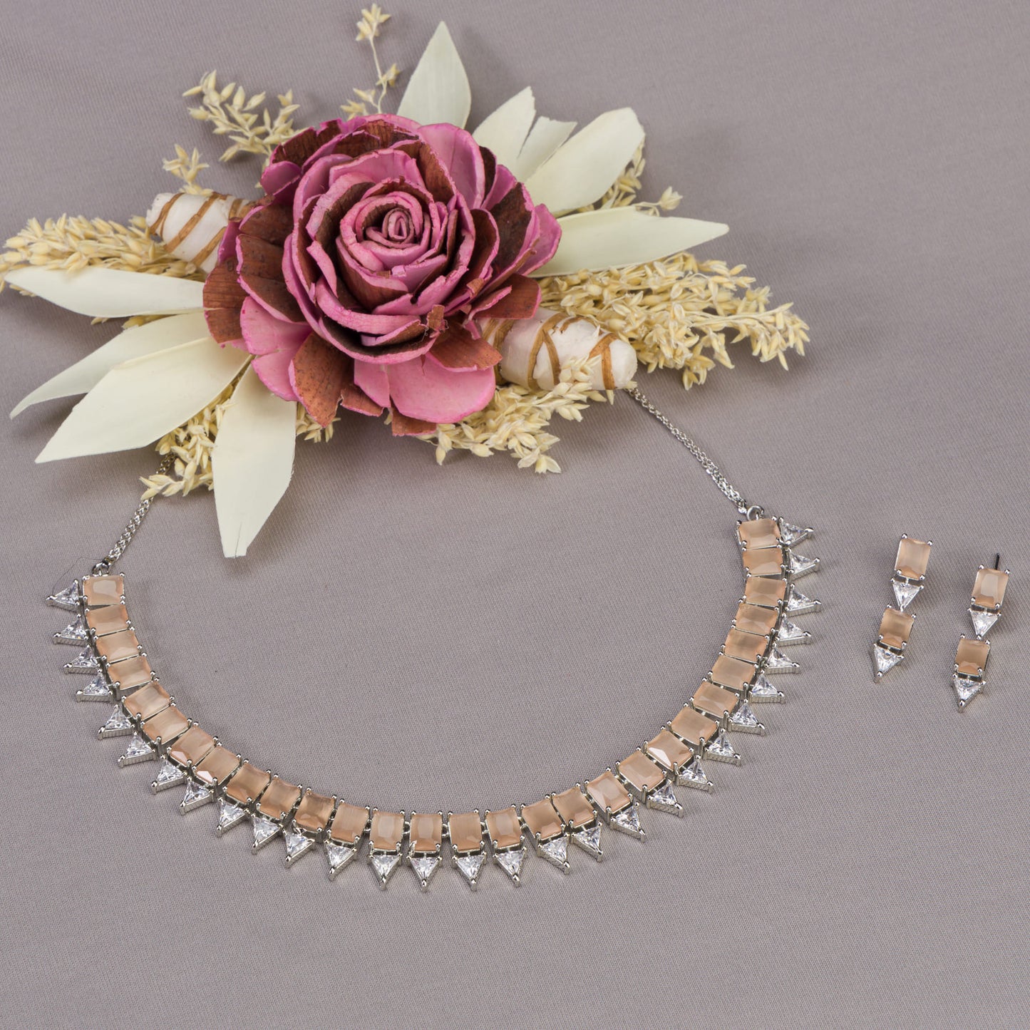 A BRONZE AND WHITE ZIRCON NECKLACE EXUDES ELEGANT CONTRAST.