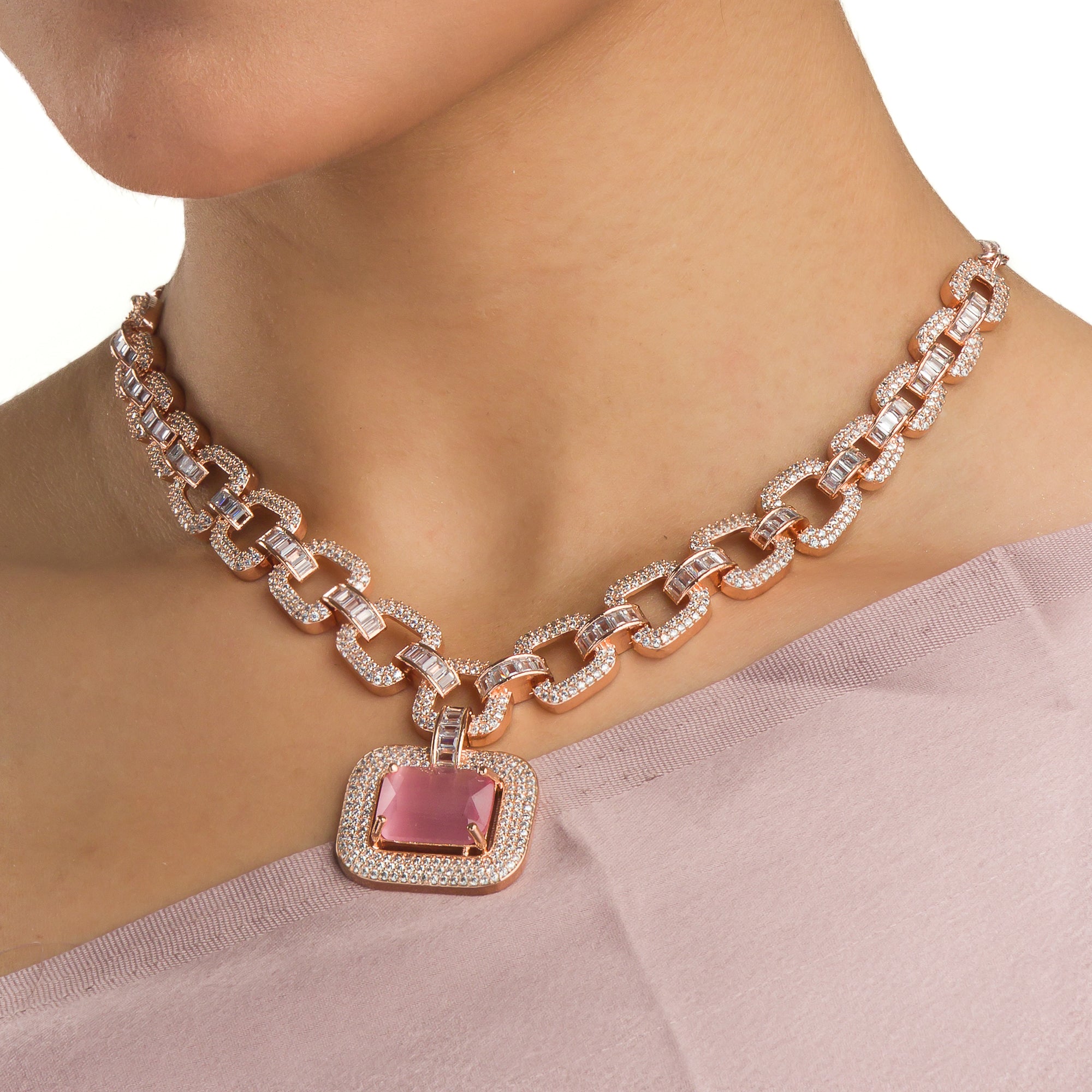 "Pink square and white zircon necklace with rose gold polish shines elegantly."
