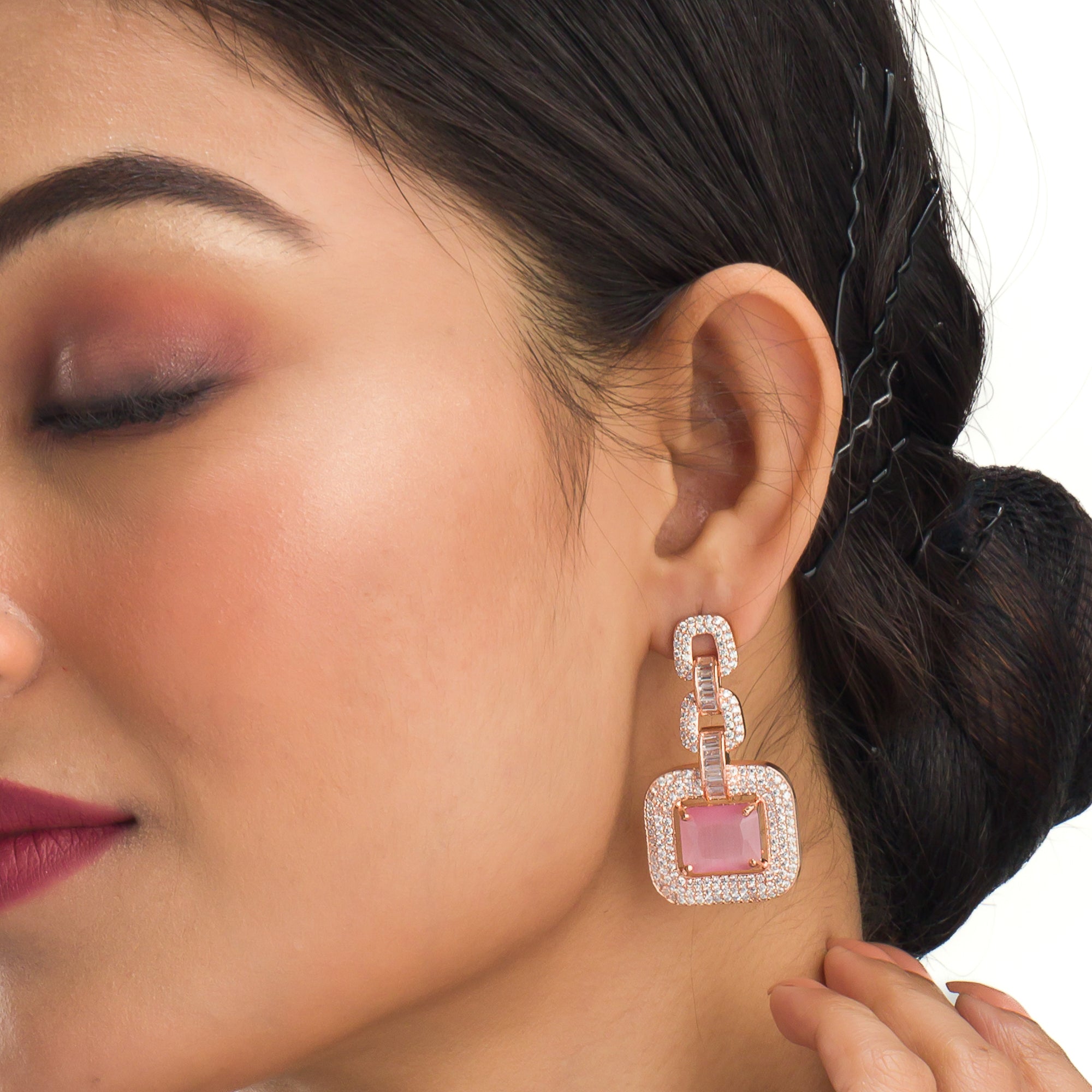 "Pink square and white zircon necklace with rose gold polish shines elegantly."
