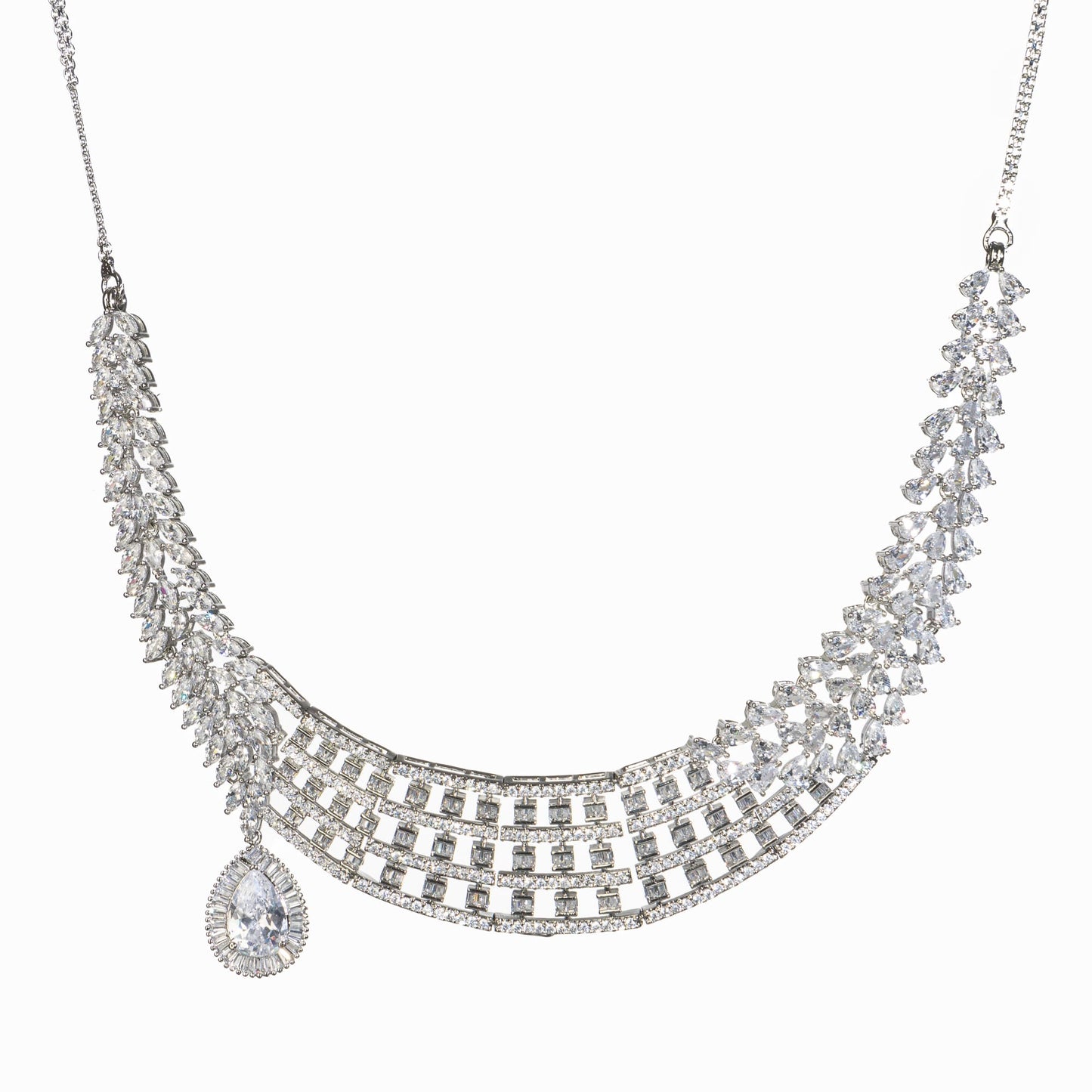 A ZIRCON NECKLACE WITH A LARGE ZIRCON STONE DROP ADDS DRAMATIC SPARKLE.