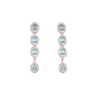 "Aqua zircon necklace with rose gold polish radiates modern elegance."
