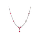 "Silver zircon necklace with maroon stone offers sophisticated, striking contrast."
