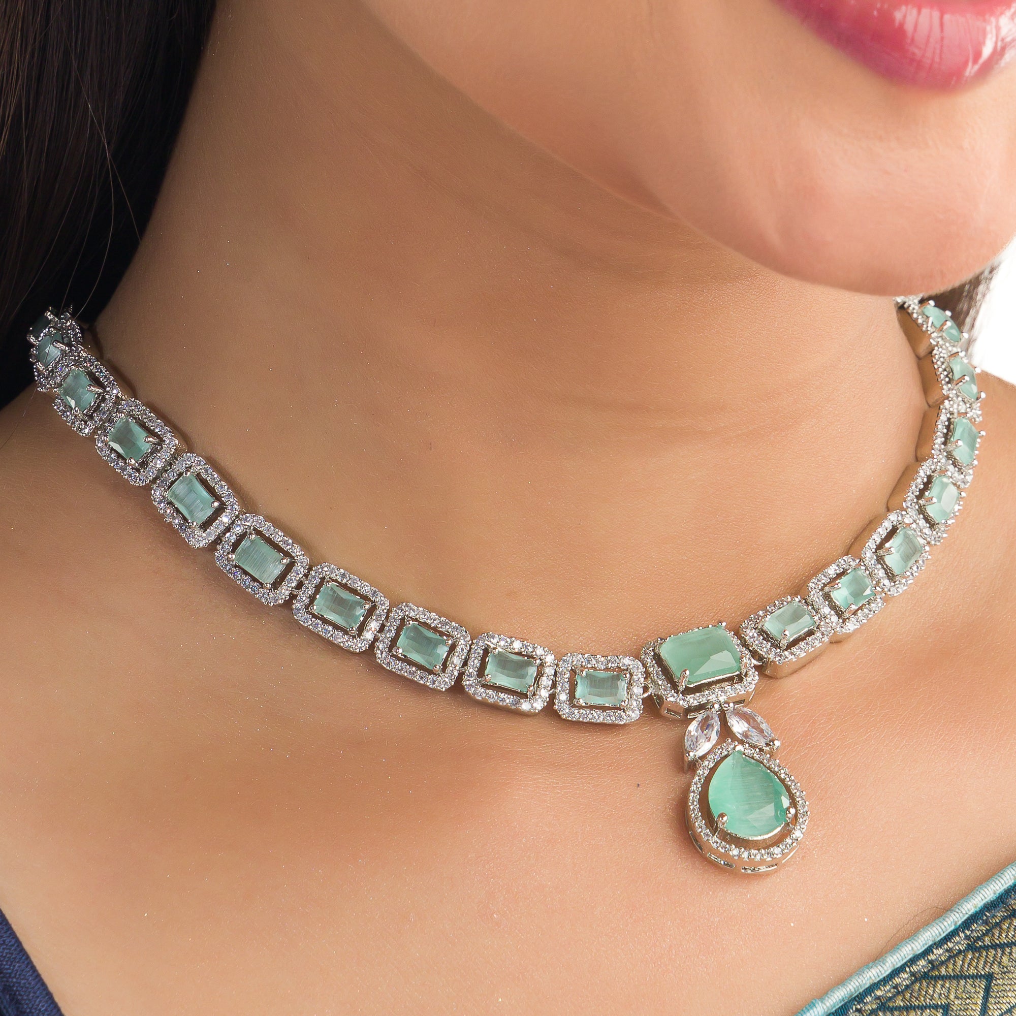 "Captivating green zircon necklace adds vibrant elegance for a festival-ready look."
