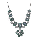 Tree-shaped necklace with green and white zircons brings a unique, elegant charm to any party look.
