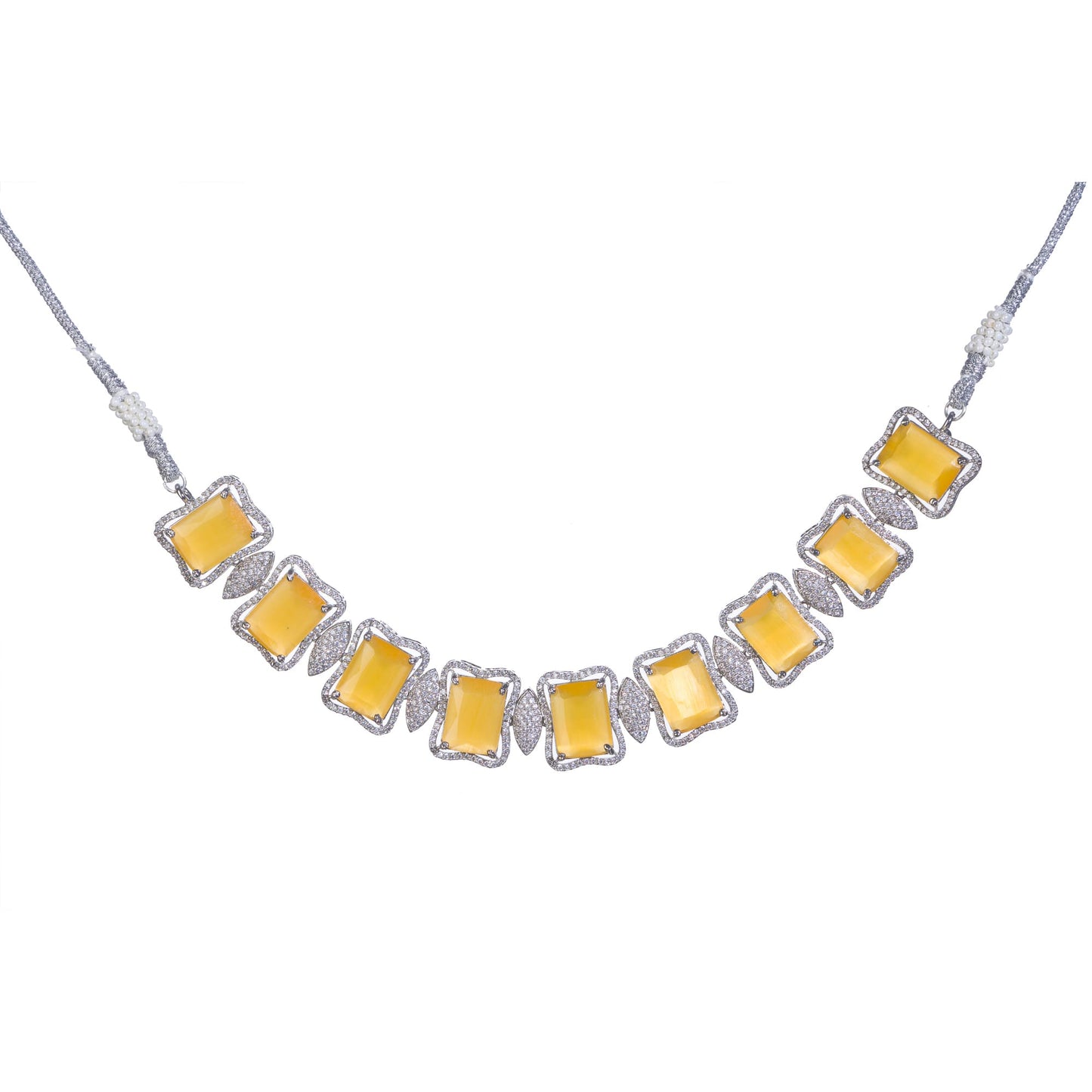 A YELLOW AND WHITE ZIRCON NECKLACE SPARKLES WITH VIBRANT CONTRAST.