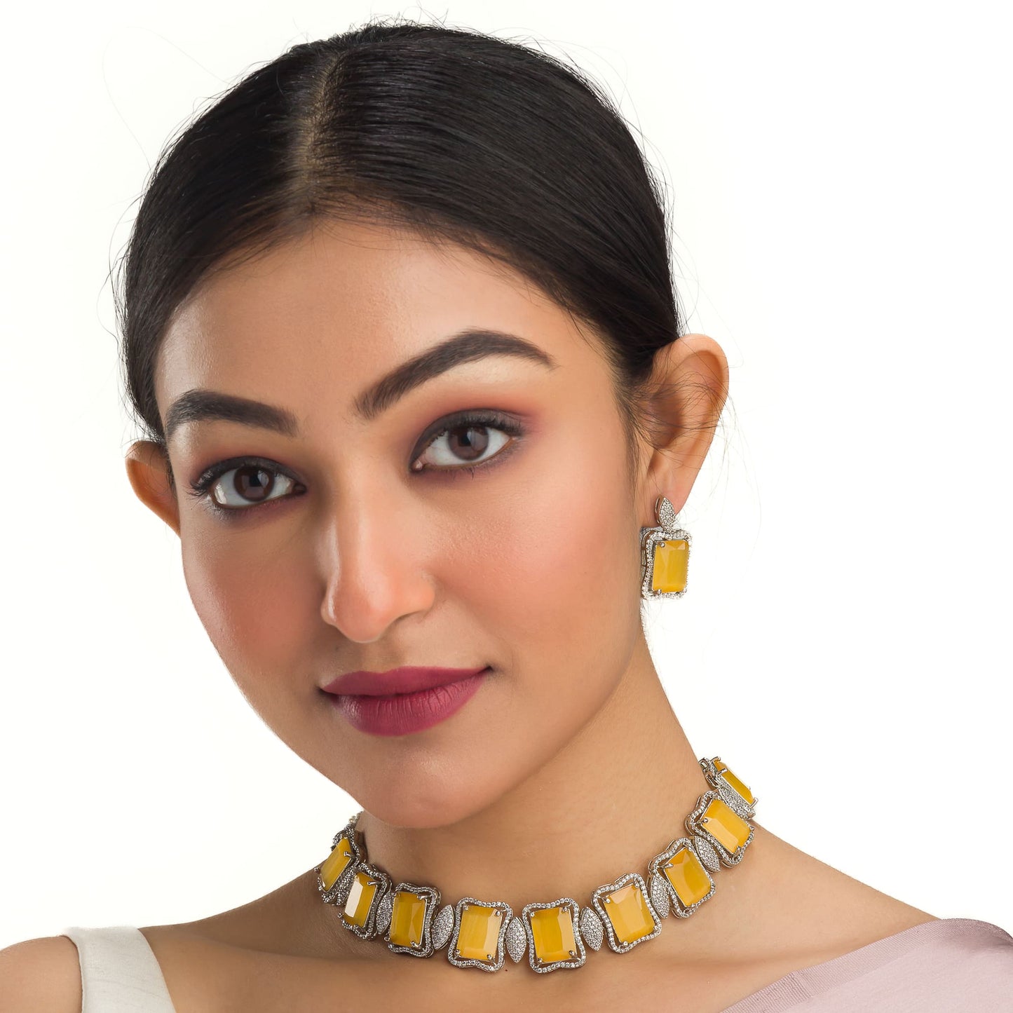 A YELLOW AND WHITE ZIRCON NECKLACE SPARKLES WITH VIBRANT CONTRAST.