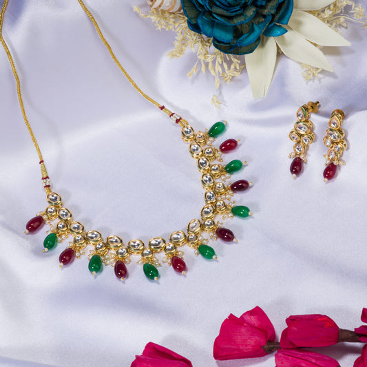 ELEGANT KUNDAN NECKLACE FEATURING RICH GREEN AND MAROON STONES FOR A REGAL AND SOPHISTICATED LOOK.