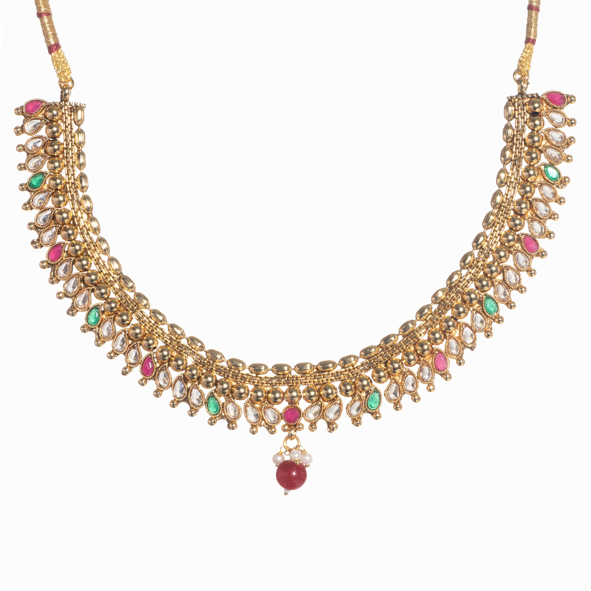 Gold-tone necklace with Kundan and Maang Tikka offers a regal and elegant party statement.
