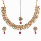 Gold-tone necklace with Kundan and Maang Tikka offers a regal and elegant party statement.
