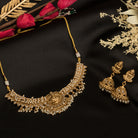 Graceful temple necklace with white pearls adds a touch of classic festival sophistication.
