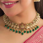 Temple necklace with green Kundan stones radiates vibrant, traditional festival elegance.
