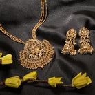 Long temple necklace showcases detailed artistry, perfect for a regal festive look.
