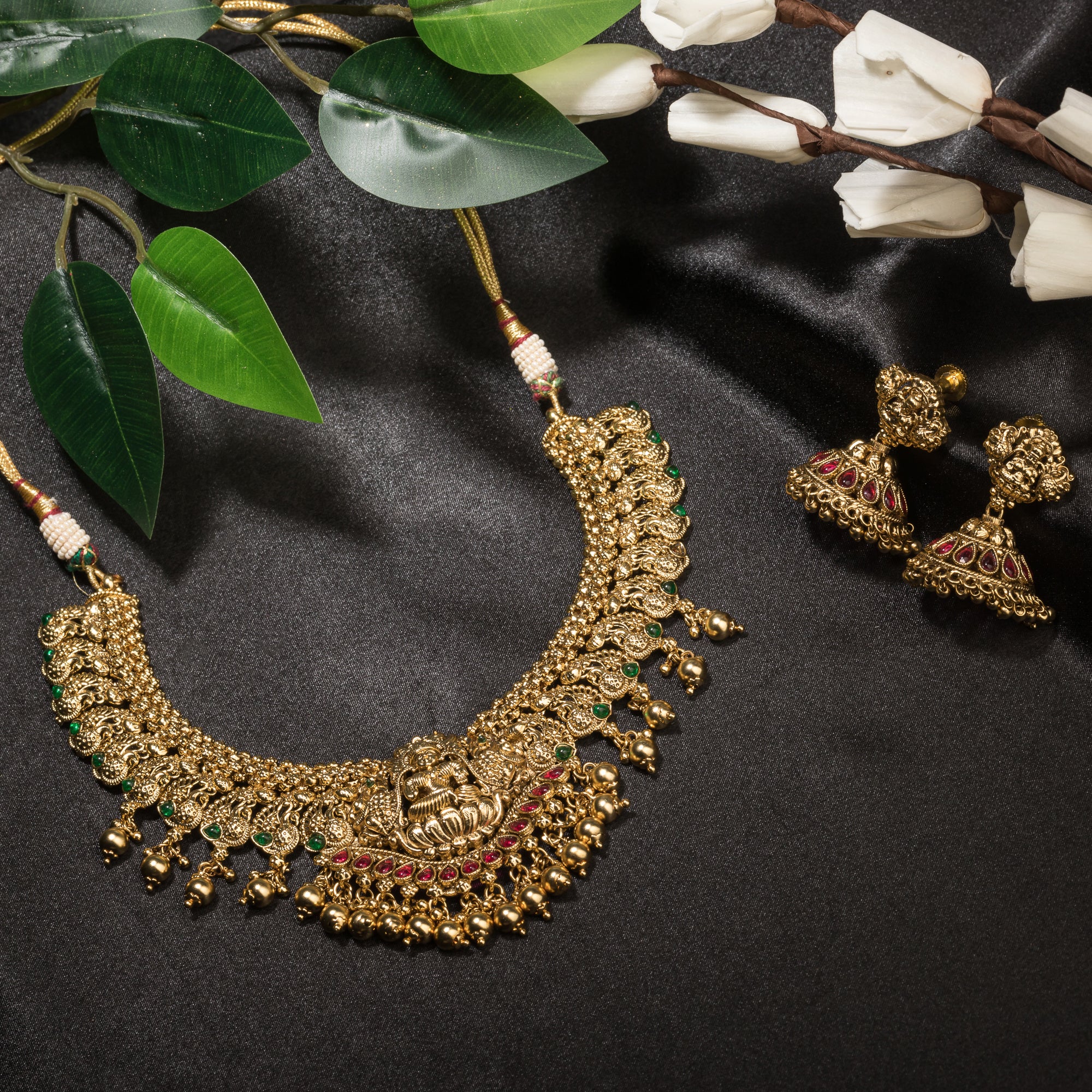 Temple necklace with intricate craftsmanship adds timeless elegance to your festive ensemble.
