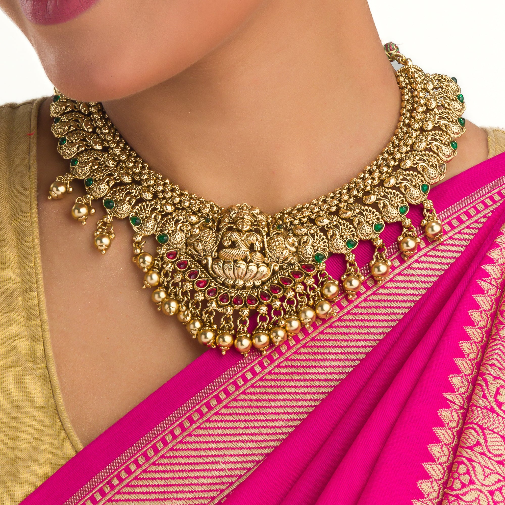 Temple necklace with intricate craftsmanship adds timeless elegance to your festive ensemble.
