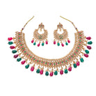 Kundan choker with maroon and green stones offers a regal and vibrant festival look.
