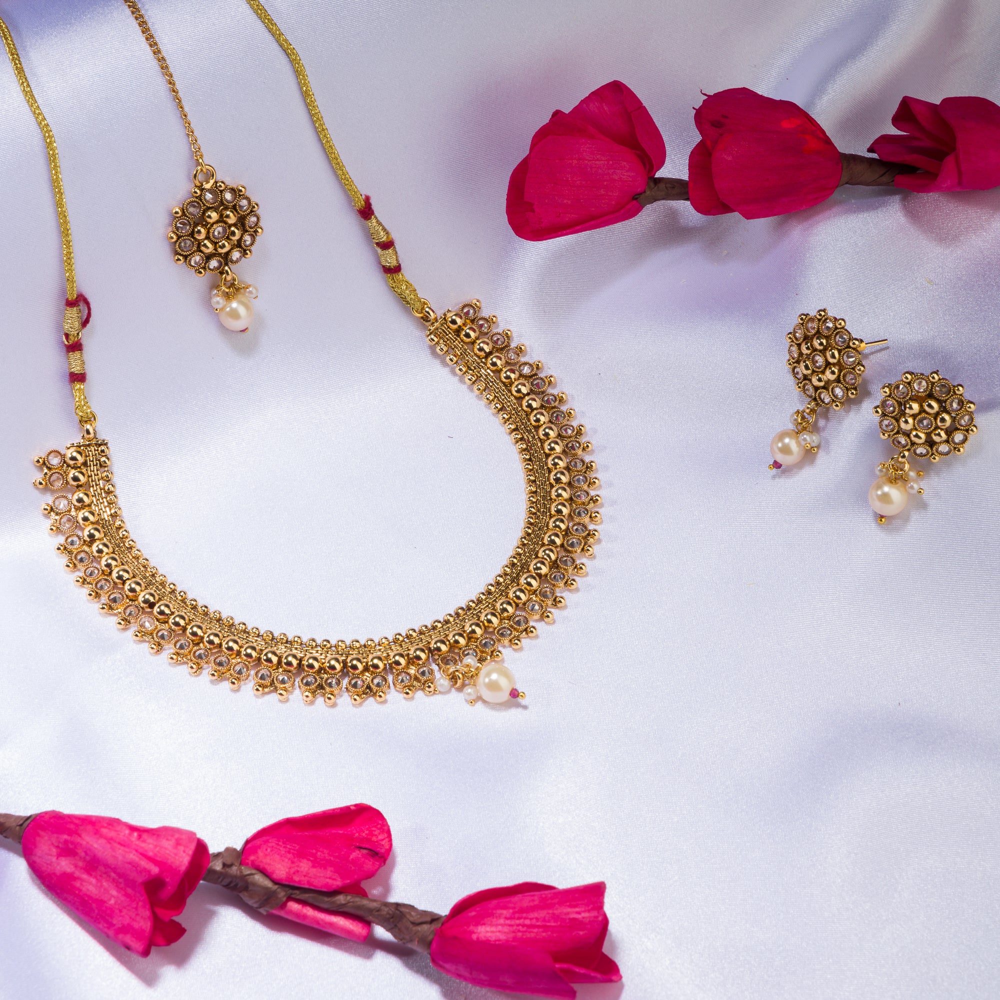 Sophisticated gold-tone choker exudes timeless charm for festive occasions.
