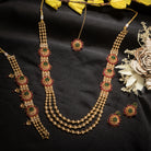 Kundan choker with maroon and green stones offers a regal and vibrant festival look.
