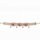 Kundan choker with maroon and green stones offers a regal and vibrant festival look.
