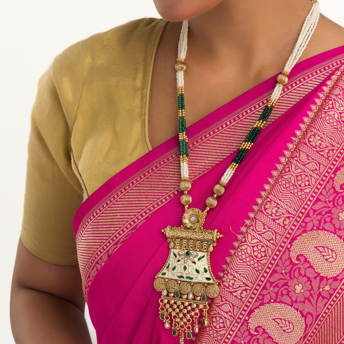 A PINK AND WHITE AND GREEN GOLD-TONE LONG NECKLACE OFFERS ELEGANT, MODERN CHARM.