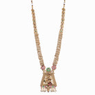 Long temple necklace with white pearls radiates timeless golden elegance for festive occasions.
