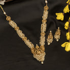 Luxurious temple long necklace with white pearls radiates opulence and refined elegance for festivals.
