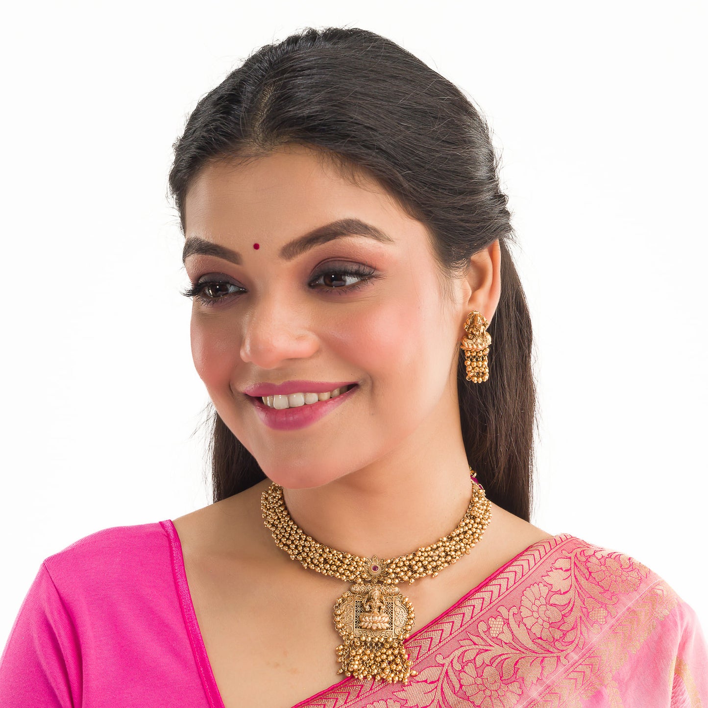 ELEGANT GOLDEN TEMPLE CHOKER EMBELLISHED WITH SMALL GOLDEN BEADS FOR A SOPHISTICATED AND TRADITIONAL LOOK.