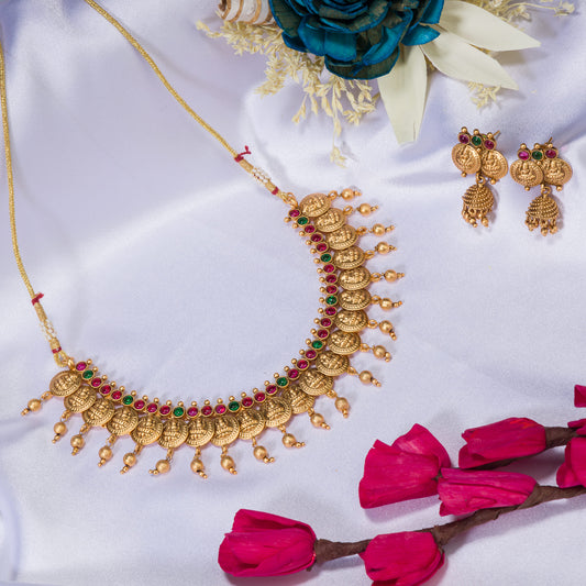 COIN-STYLE GOLD-TONE TEMPLE JEWELRY EXUDES CLASSIC ELEGANCE AND TRADITION.