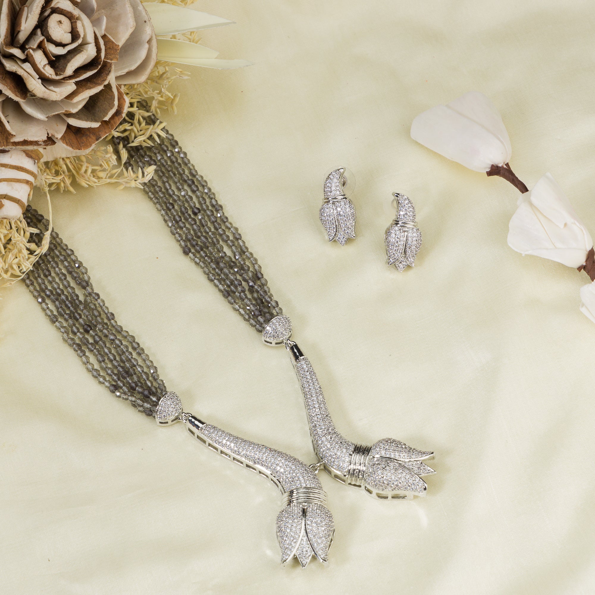 Trendy long grey zircon necklace with silver accents offers sleek, modern sophistication.
