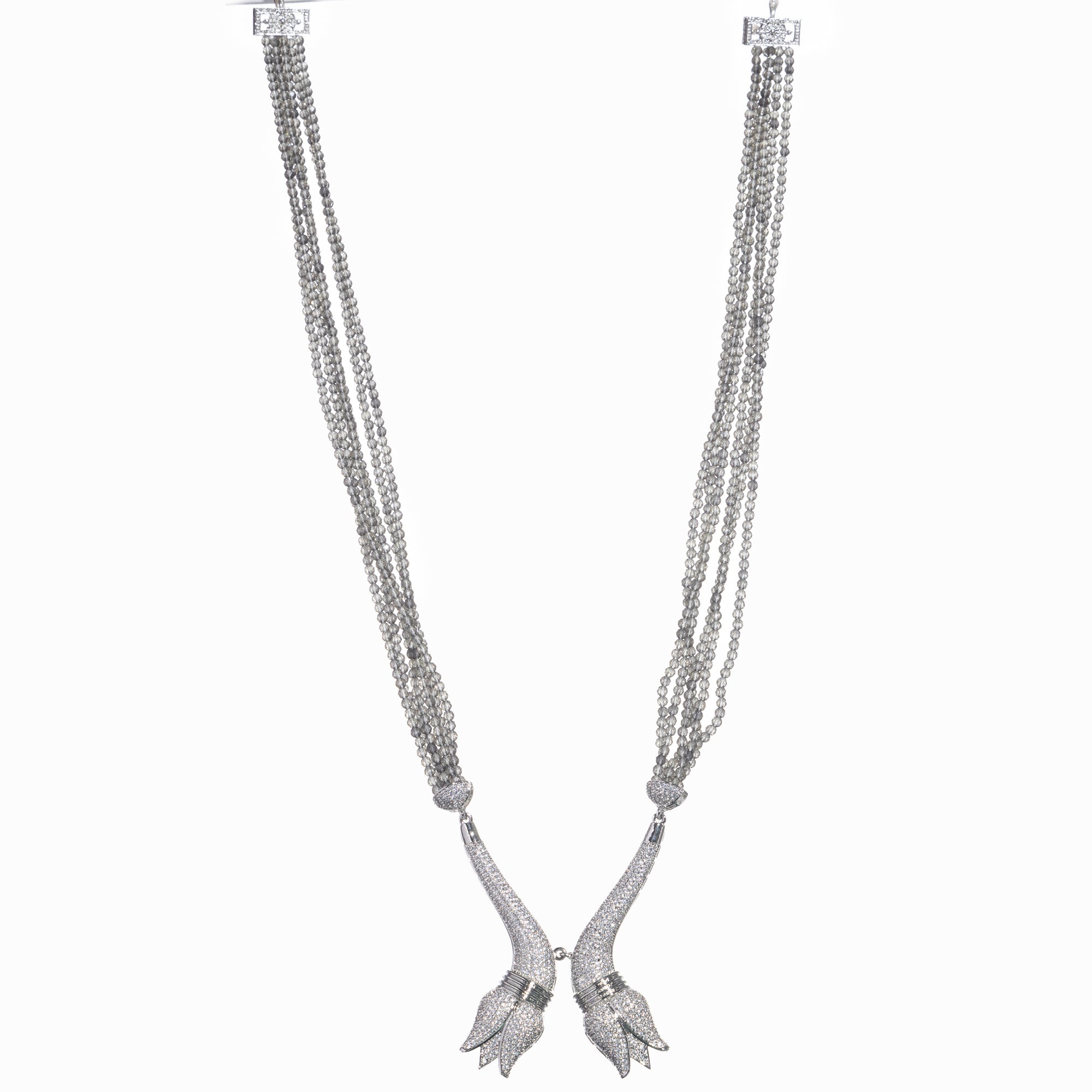 Trendy long grey zircon necklace with silver accents offers sleek, modern sophistication.
