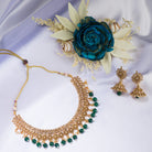 "Stylish gold-tone necklace with green Kundan for vibrant, elegant appeal."
