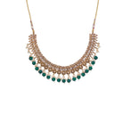 "Stylish gold-tone necklace with green Kundan for vibrant, elegant appeal."
