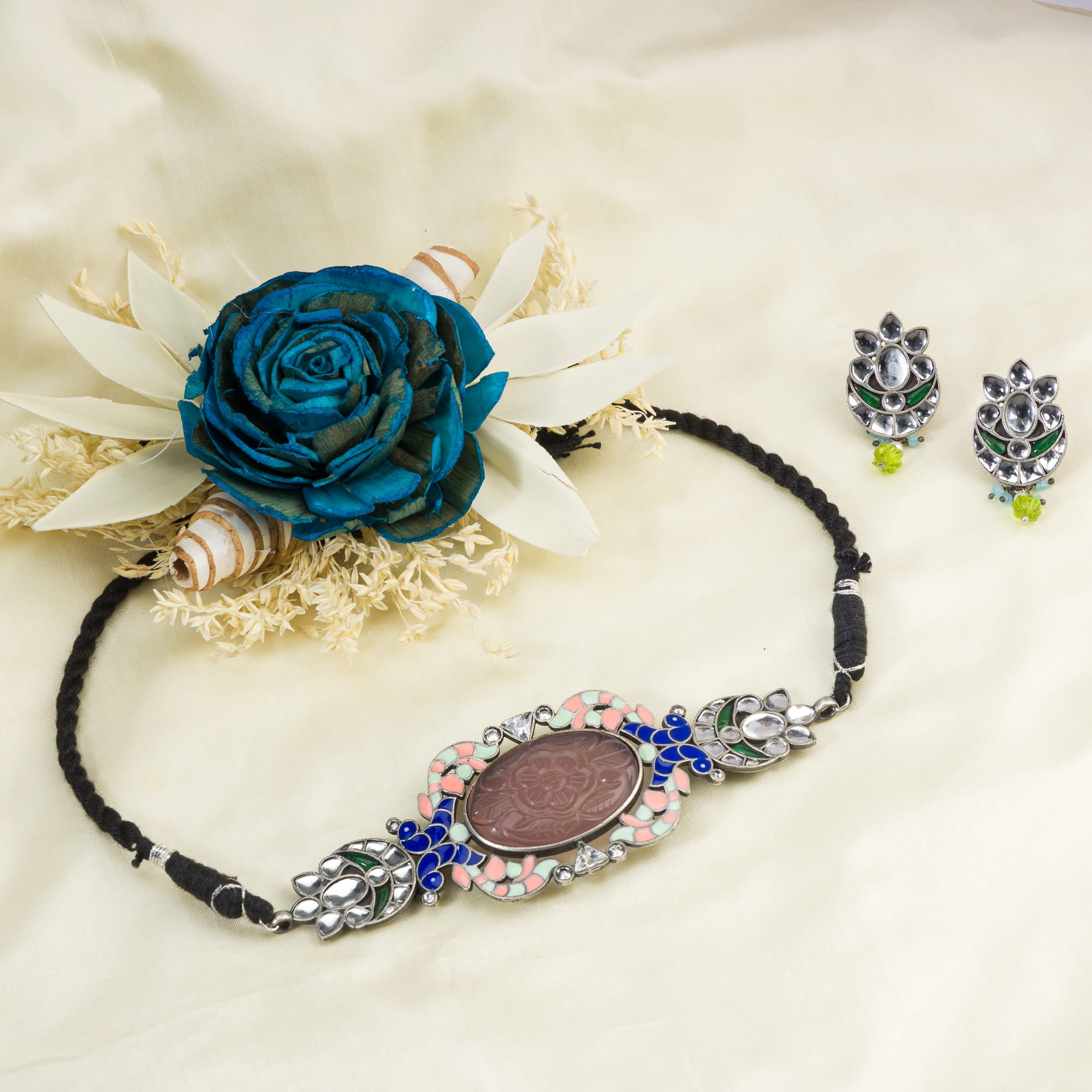 Oxidised choker set with multi-colour stones for a vintage-inspired, antique finish.
