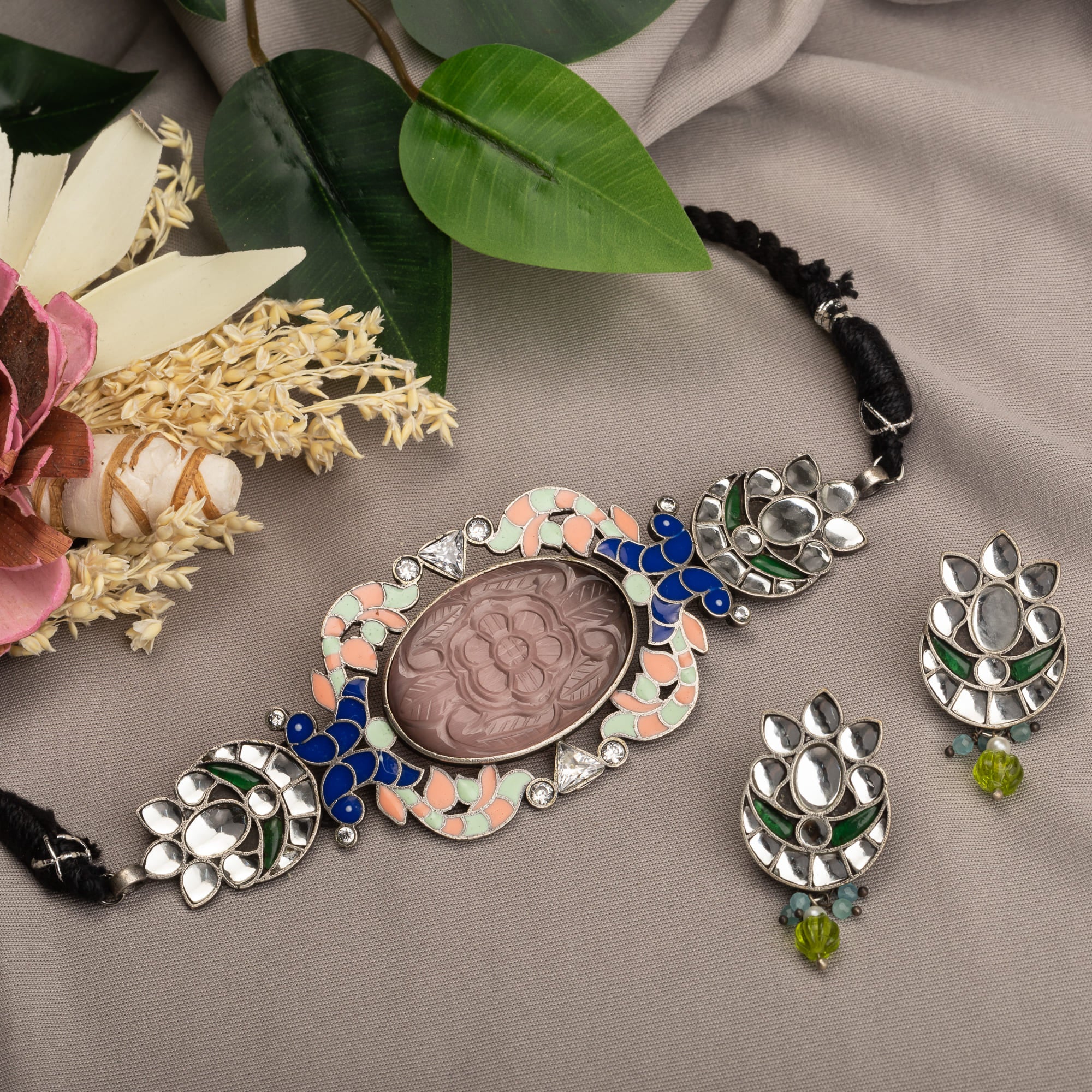 Oxidised choker set with multi-colour stones for a vintage-inspired, antique finish.
