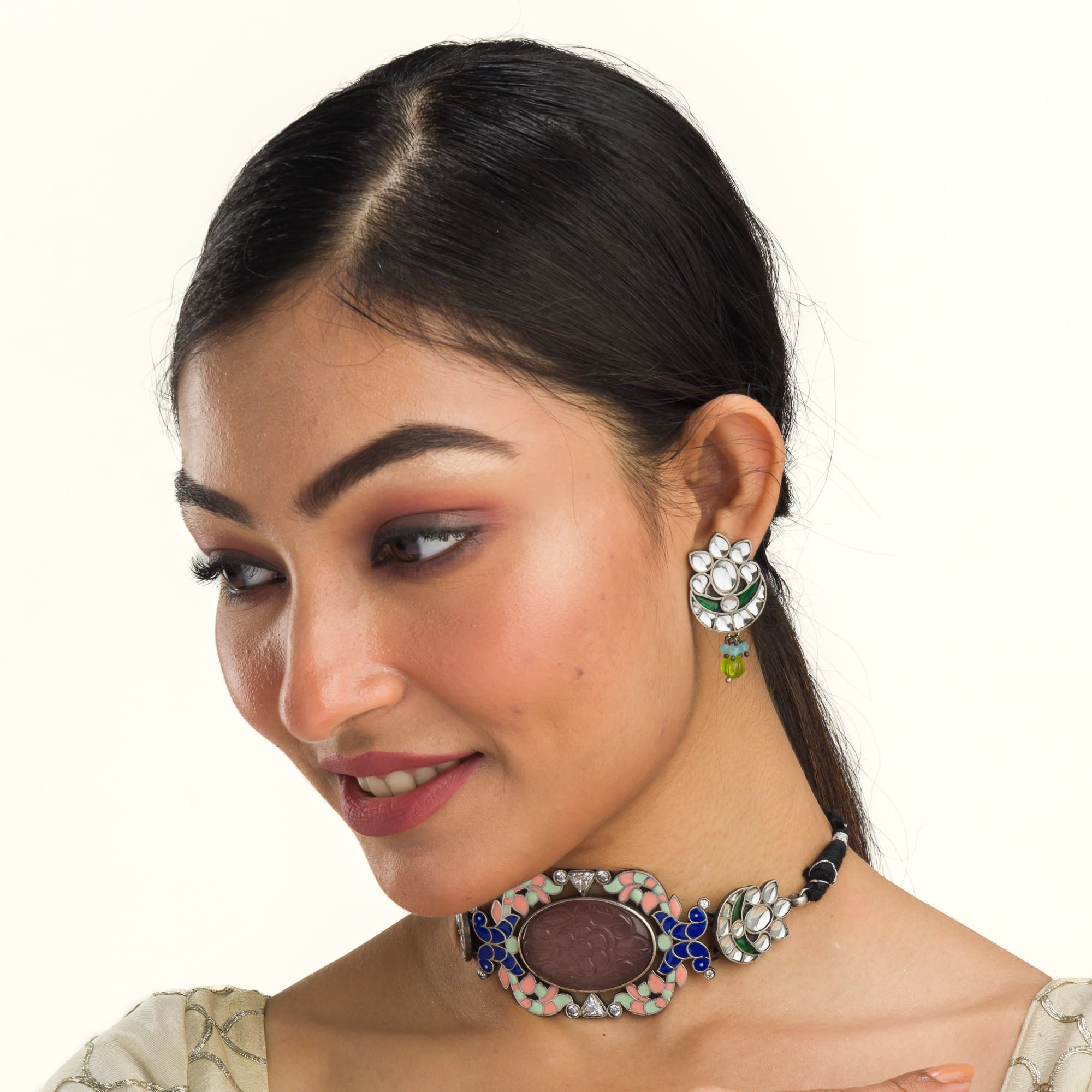 Oxidised choker set with multi-colour stones for a vintage-inspired, antique finish.
