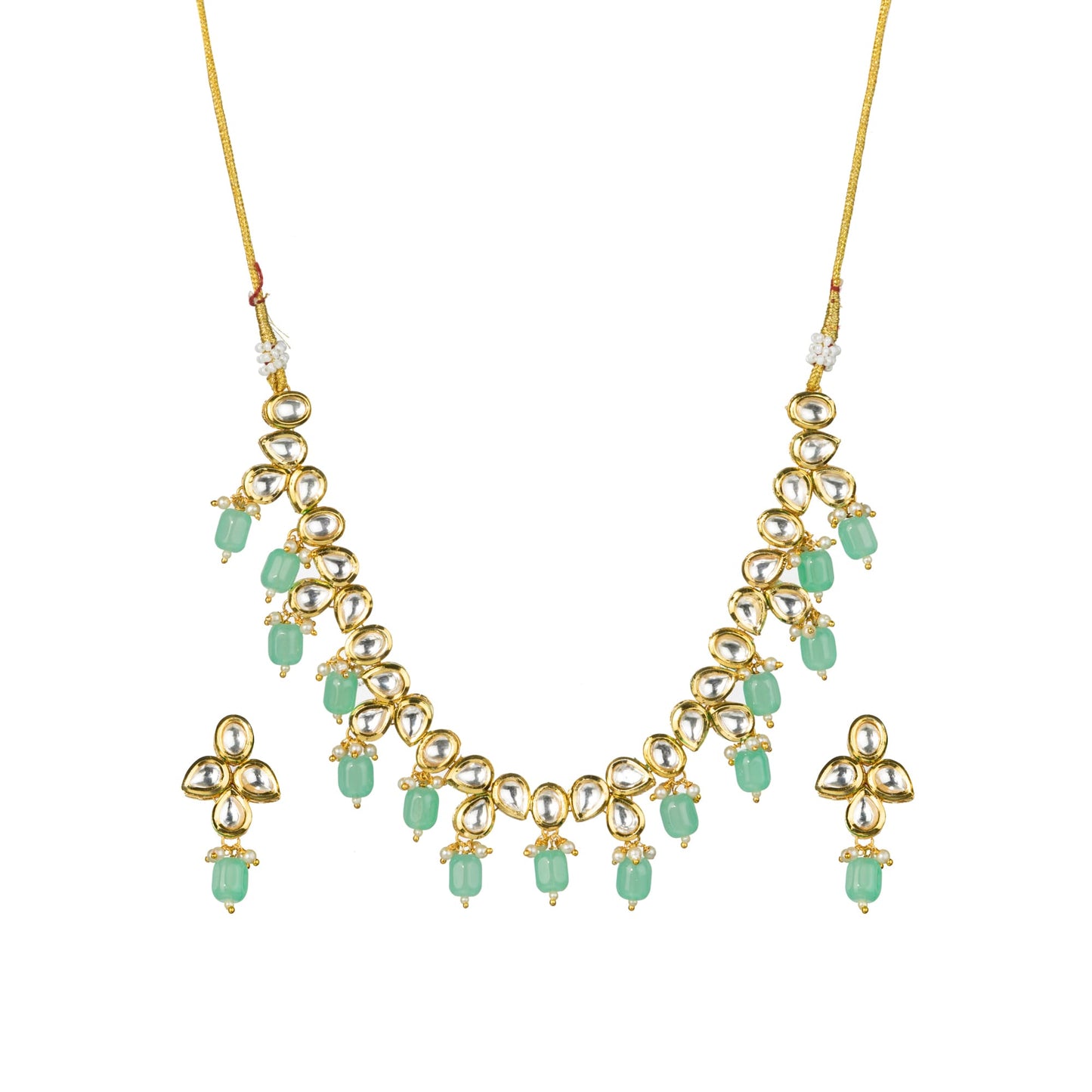 A GREEN KUNDAN NECKLACE RADIATES VIBRANT ELEGANCE.