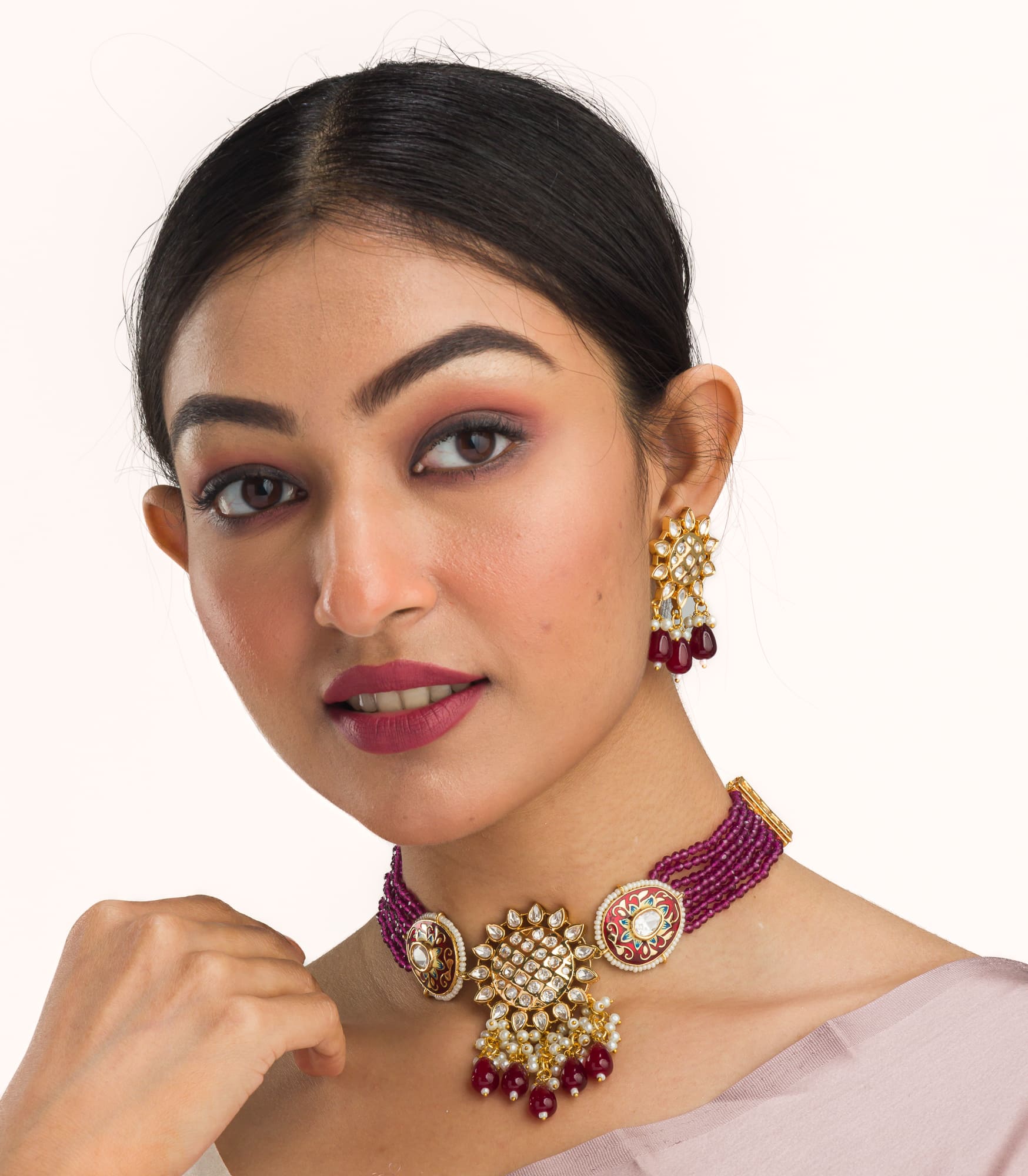 Pink kundan choker with gold-tone polish for a vibrant, elegant style.
