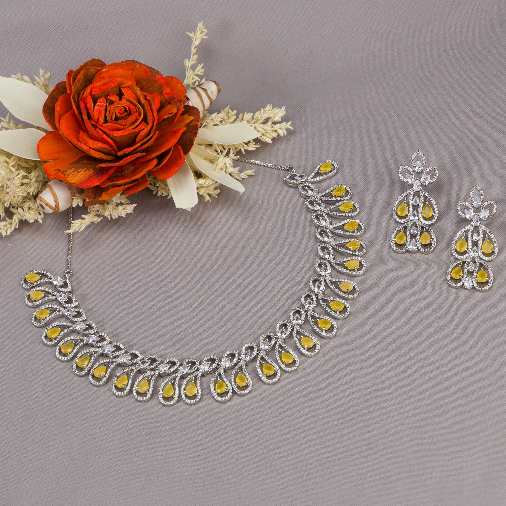 Yellow and white zircon stones create a dazzling contrast in this elegant necklace.
