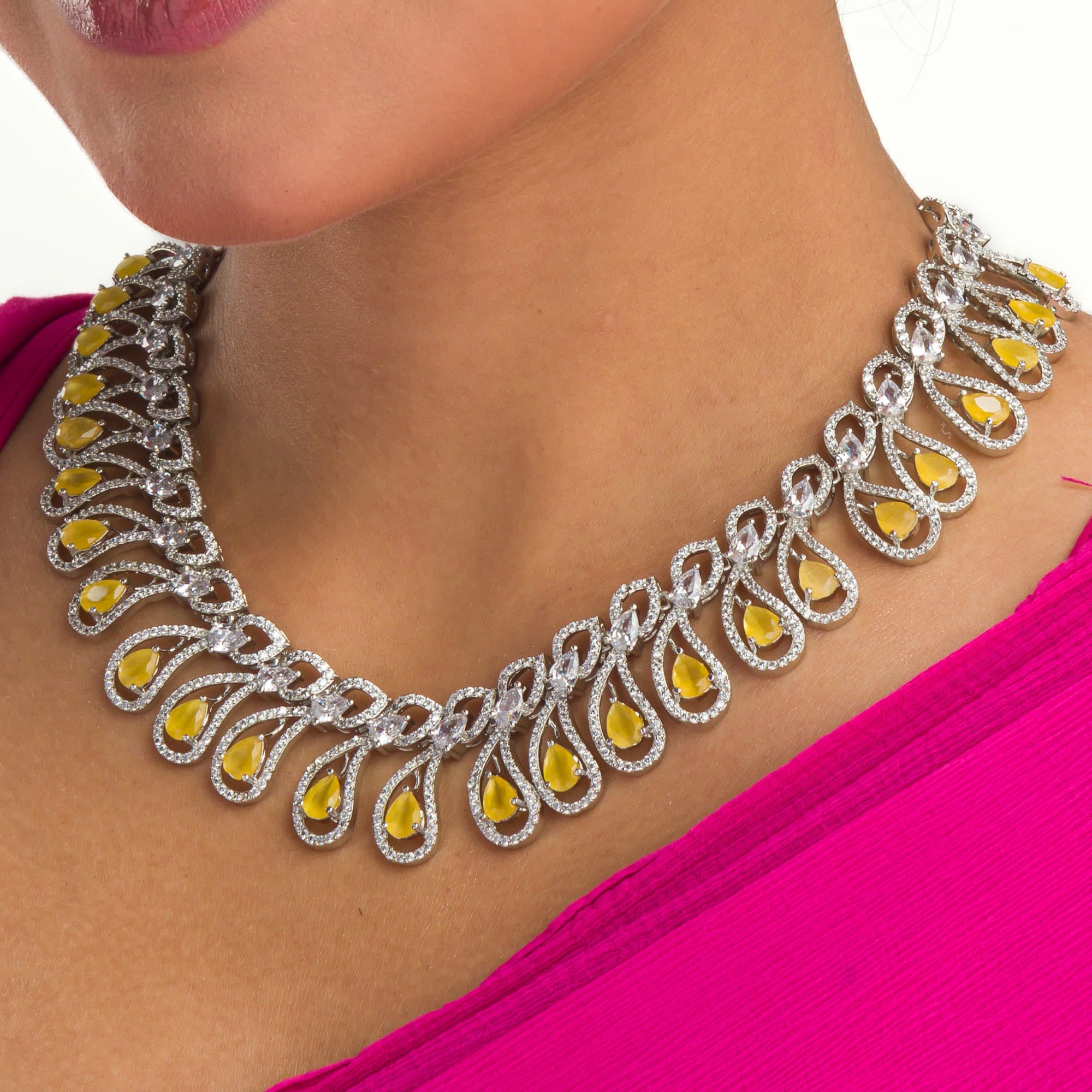 Yellow and white zircon stones create a dazzling contrast in this elegant necklace.
