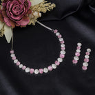 Pink and white zircon stones combine for a vibrant, elegant necklace design.
