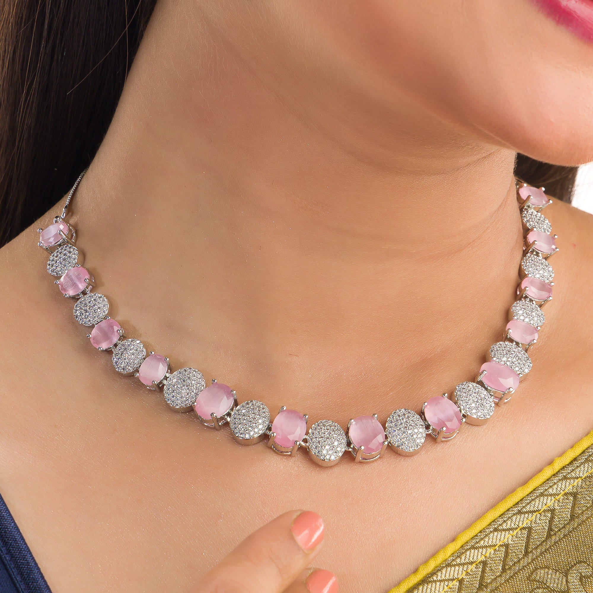 Pink and white zircon stones combine for a vibrant, elegant necklace design.
