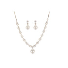 Small S-shaped zircon necklace with gold polish offers delicate elegance and subtle sparkle.
