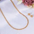 Classic gold-tone long necklace with sleek design for timeless elegance
