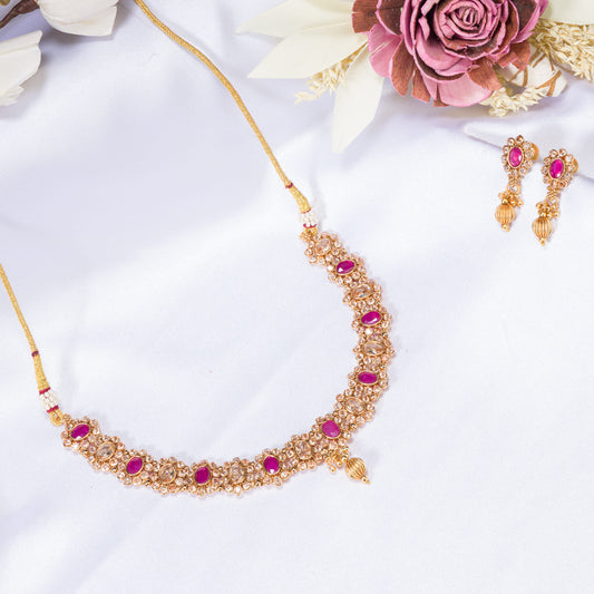 GOLD TONE NECKLACE WITH PINK STONE