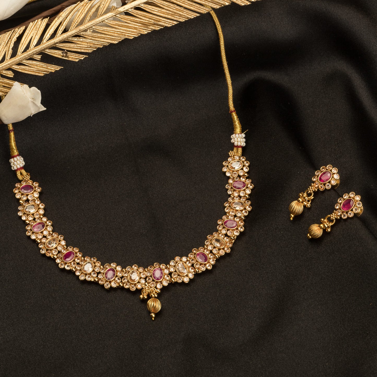 GOLD TONE NECKLACE WITH PINK STONE